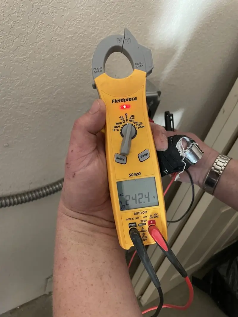 Voltage testing with clamp meter during Recessed Lighting Installation in Pimmit Hills